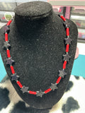 Black star with red coral necklace