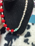 Red and mother of pearl fish necklace
